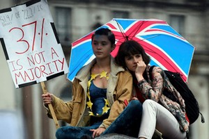 Demonstrators take part in a protest aimed at showing London's solidarity with the European Union fo