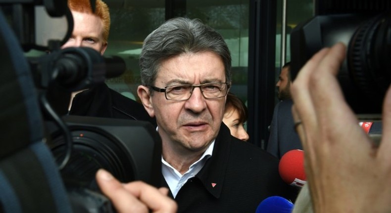 French presidential election candidate for the far-left coalition La France insoumise Jean-Luc Melenchon visits the library of the Lille 1 University in Villeneuve-d'Ascq, northern France, on April 11, 2017, as part of a campaign visit