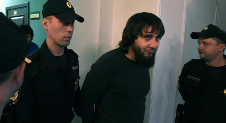 Zaur Dadayev, one of five defendants found guilty by a Moscow court over the 2015 murder of Russian opposition leader Boris Nemtsov, seen here being escorted by police officers on June 22.