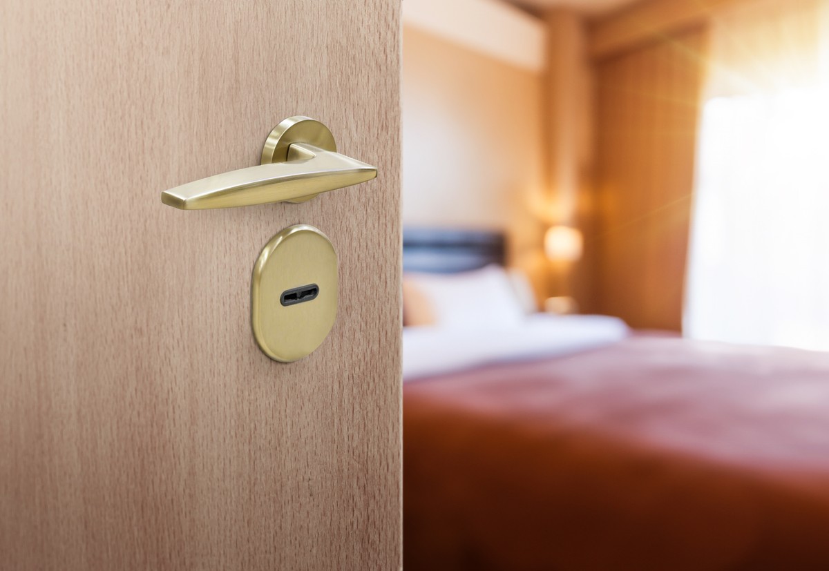 Half,Opened,Door,Of,Hotel,Room,Or,Apartment,Doorway,With
