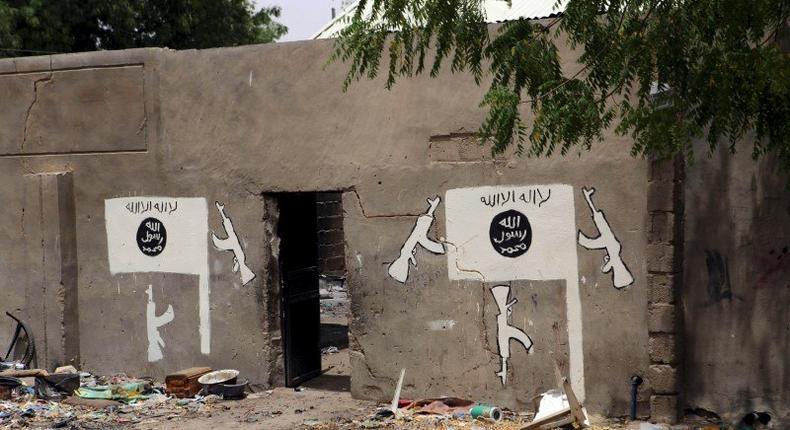 A wall painted by Boko Haram is pictured in Damasak, Nigeria March 24, 2015. REUTERS/Joe Penney