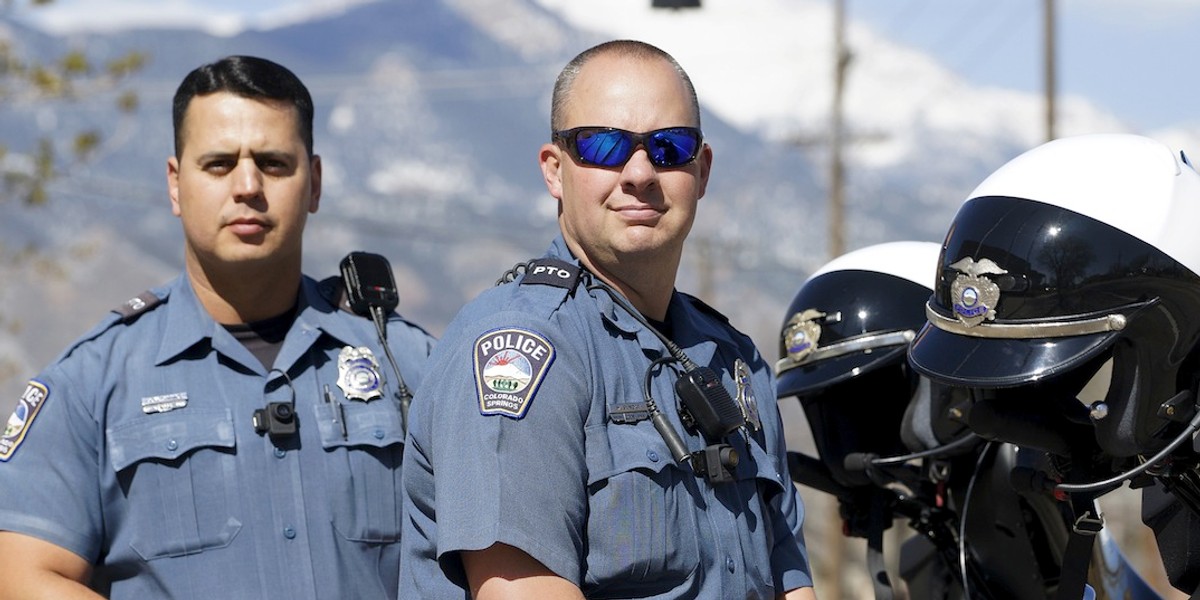 Colorado Springs, Colorado, motor officers pose with Digital Ally First Vu HD body cameras.