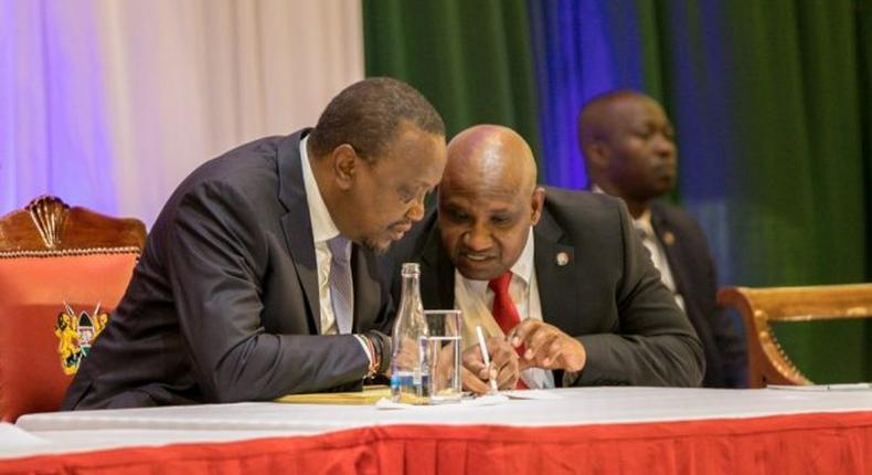 President Uhuru Kenyatta and KRA Commissioner General James Githii Mburu at the 2019 annual taxpayers day