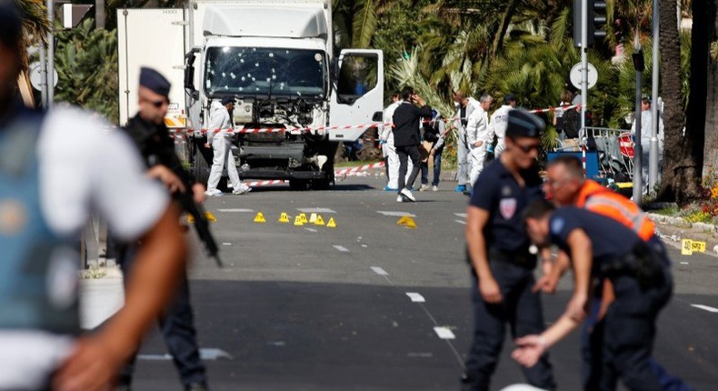 French police secure the area as the investigation continues at the scene near the heavy truck that ran into a crowd at high speed killing scores who were celebrating the Bastille Day July 14 national holiday on the Promenade des Anglais in Nice, France, July 15, 2016.    REUTERS/Eric Gaillard