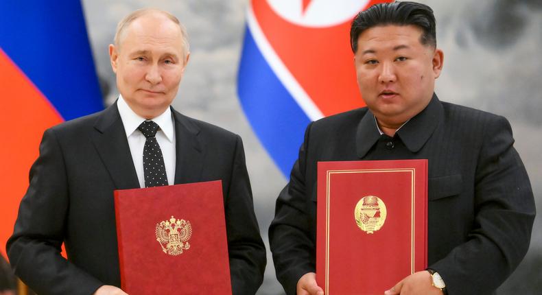 Russian President Vladimir Putin, left, and North Korea's Kim Jong Un pose for a photo during a signing ceremony of the new partnership in Pyongyang, North Korea.Kristina Kormilitsyna, Sputnik, Kremlin Pool Photo via AP