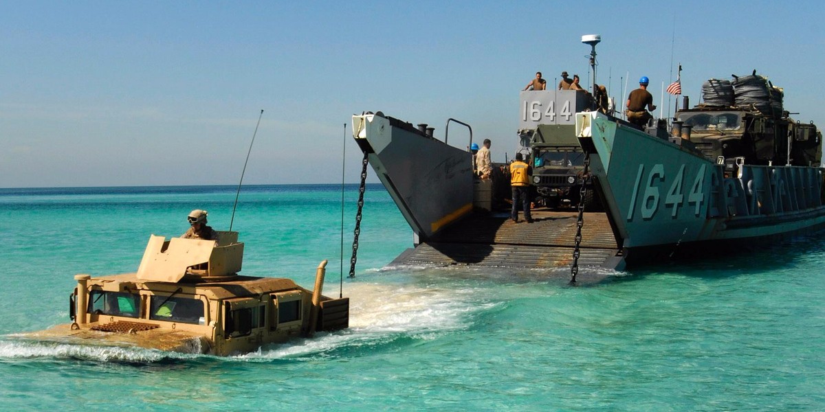 An HMMWV launches from a landing craft utility assigned to the amphibious dock landing ship USS Whidbey Island.