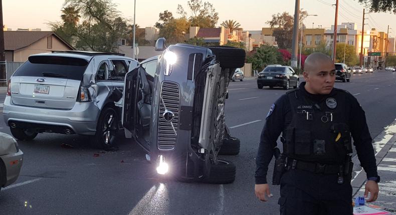 A photo posted on Fresco News' Twitter feed showed a self-driving Uber Volvo SUV on its side.