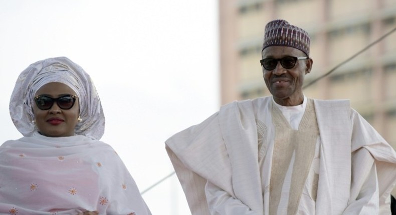 Nigerian President Mohammadu Buhari arrives with his wife Aisha, before taking oath of office at the Eagles Square in Abuja, on May 29, 2015