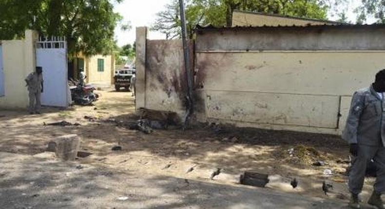 Security officers stand next to the site of a suicide bombing in Ndjamena, Chad, June 15, 2015.