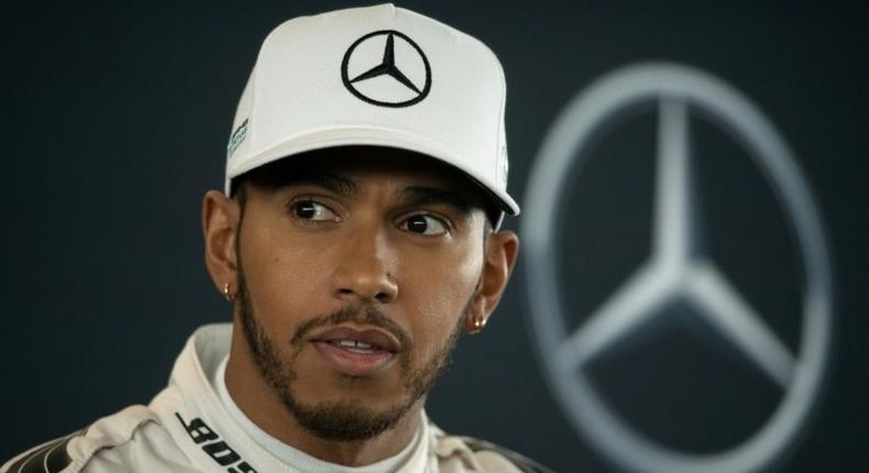 Mercedes driver Lewis Hamilton speaks during a launch event at the Silverstone circuit near Towcester, central England, on February 23, 2017