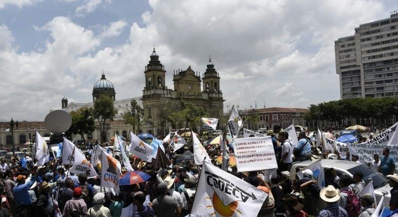 Members of the Peasant Development Committee take part in a demonstration demanding Guatemalan President Jimmy Morales' resignation in Guatemala City on August 28, 2017