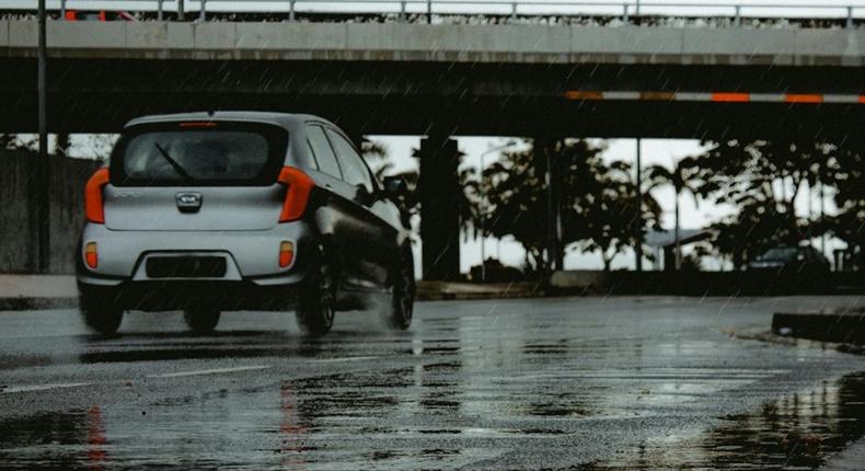 Silver car driving on a wet road [Image Credit: Eddy Silva Official]