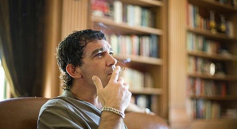 Antonio Banderas smoking a cigarette.