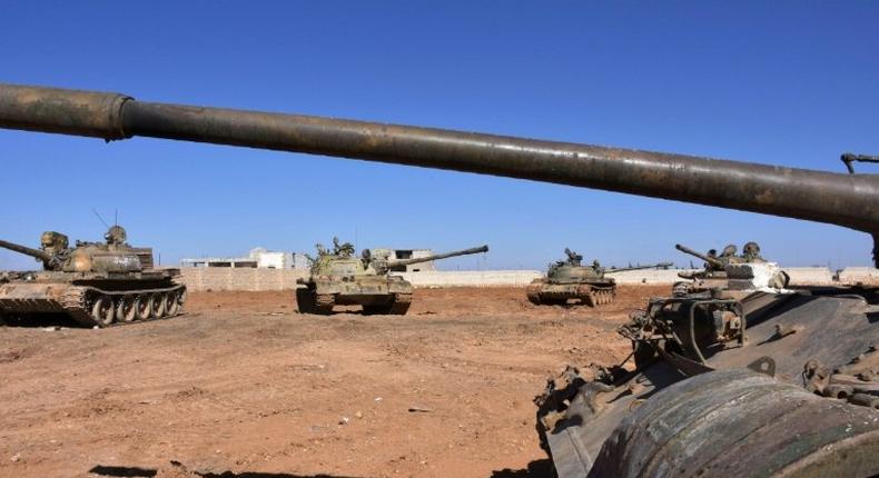 Syrian army tanks are positioned on the eastern outskirts of the northern Syrian city of Aleppo on February 17, 2017