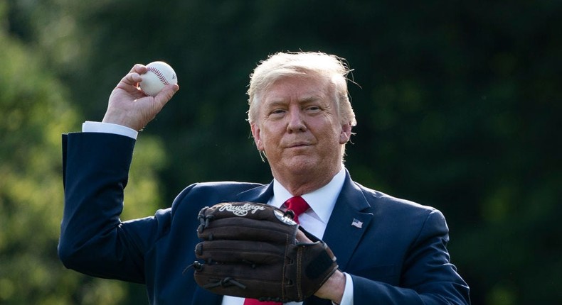 President Donald Trump throws a baseball on the South Lawn of the White House on July 23, 2020 in Washington, DC.
