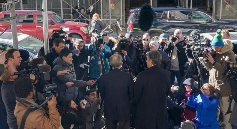 Donald Trump's former lawyer and fixer, Michael Cohen, right, and Cohen's lawyer, Lanny Davis, left, face a ravening press corps outside the Trump 'hush money' grand jury in Manhattan.Mary Altaffer/AP