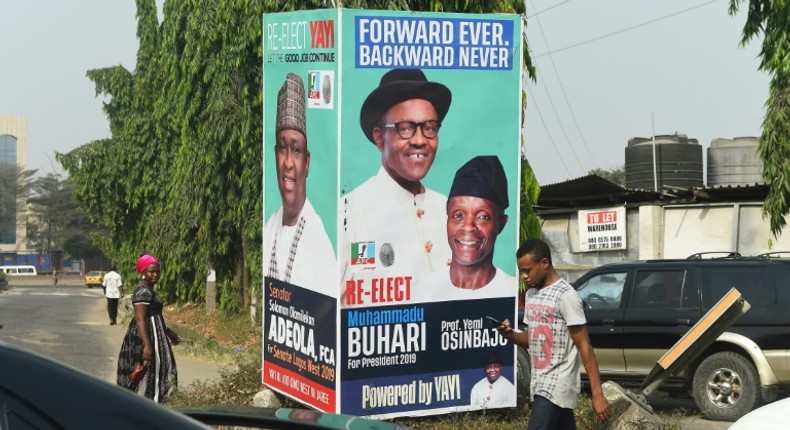 Election time: A campaign poster in Lagos for President Muhammadu Buhari and Vice President Yemi Osinbajo, contending next month's polls