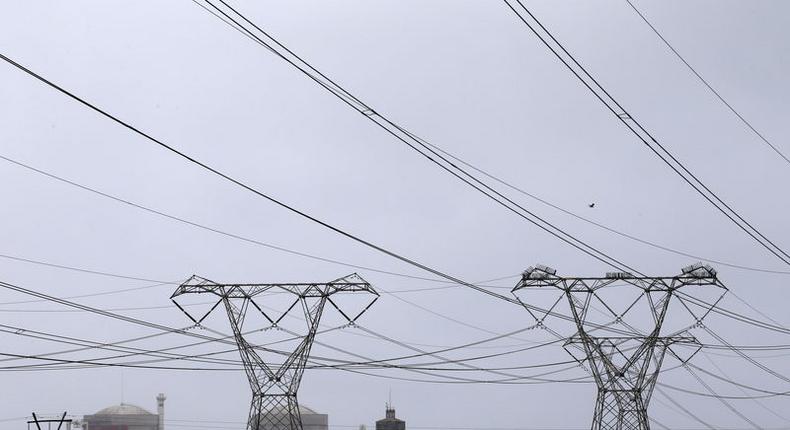 Pylons carry power from South Africa's Koeberg nuclear power plant near Cape Town August 13, 2015.    REUTERS/Mike Hutchings