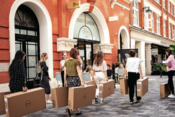 Company employees struggle to carry heavy boxes that contain Dell computing items through West End Streets, on 23rd August 2022, in London, England