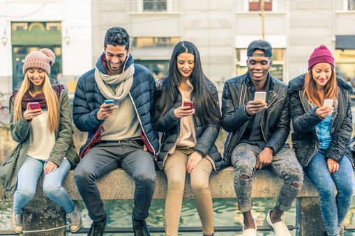 Multiracial group of people with cellphones