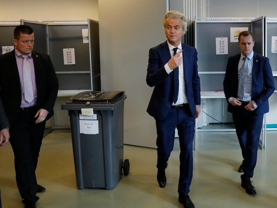 Dutch far-right politician Geert Wilders of the PVV party surrounded by security as he votes in the general election in The Hague, Netherlands, March 15, 2017.