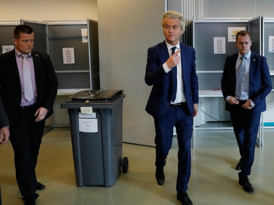 Dutch far-right politician Geert Wilders of the PVV party surrounded by security as he votes in the general election in The Hague, Netherlands, March 15, 2017.