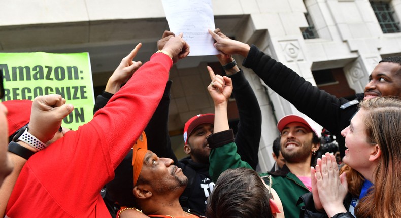 Union organizers and Amazon workers celebrate following a successful union vote in Staten Island, New York, on April 1.