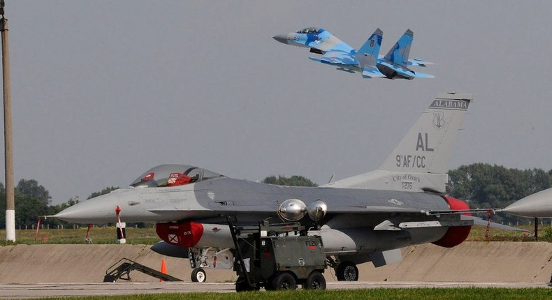 A Ukrainian Su-27 takes off behind a California Air National Guard F-16C at a base in Ukraine in July 2011.US Air National Guard/Tech. Sgt. Charles Vaughn