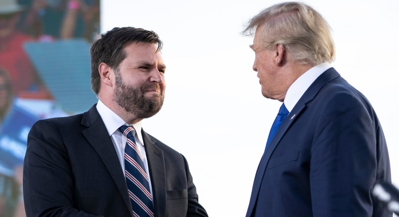 J.D. Vance, a Republican candidate for U.S. Senate in Ohio, shakes hands with former President Donald Trump during a rally hosted by the former president at the Delaware County Fairgrounds on April 23, 2022 in Delaware, Ohio. Last week, Trump announced his endorsement of J.D. Vance in the Ohio Republican Senate primary.