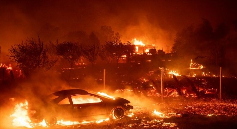 Vehicles and homes have been destroyed by the Camp Fire in Paradise, California