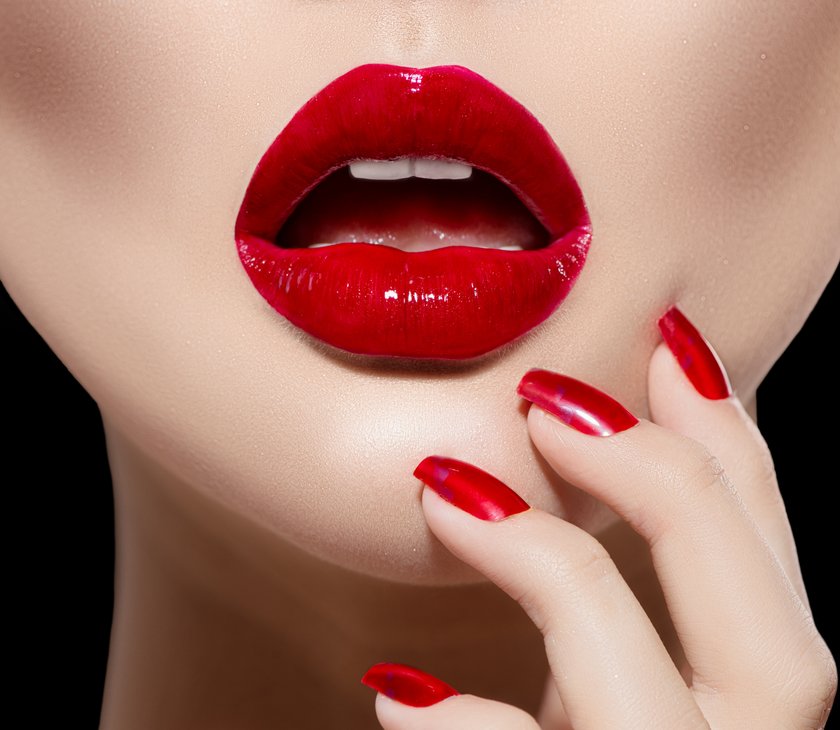 Red Sexy Lips and Nails closeup. Manicure and Makeup