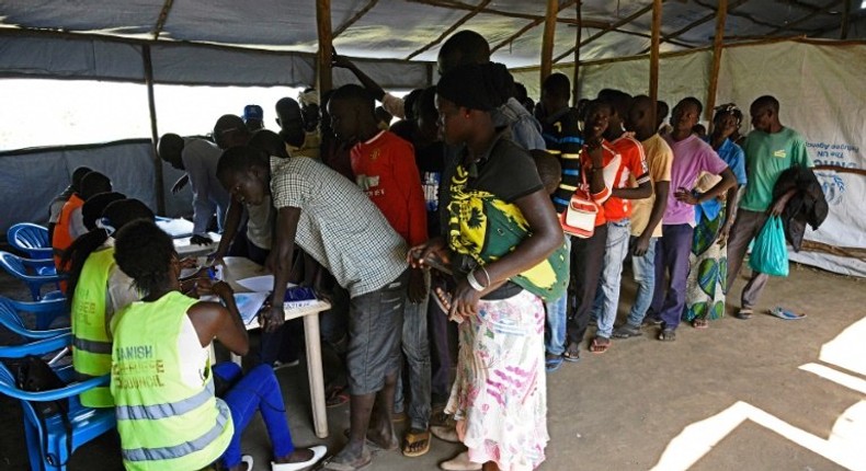 Newly arrived refugees from South Sudan queue to be registered at Kuluba Reception Centre, north of the Ugandan capital Kampala