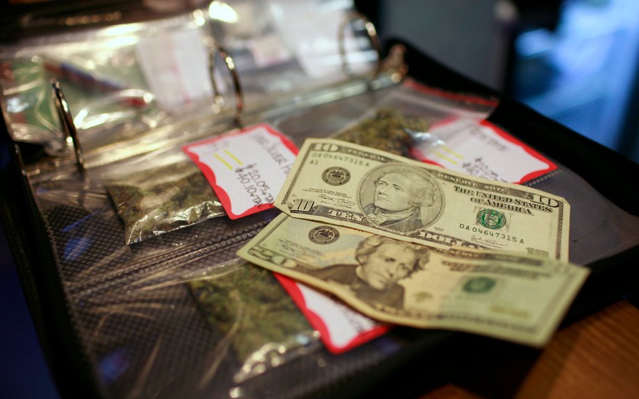 A cash transaction for medical marijuana is shown at Coffeehouse Blue Sky in Oakland, California, July 23, 2009.