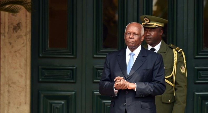 Angola's President Jose Eduardo Dos Santos waits for the arrival of his French counterpart at the presidential palace in Luanda in July 2015