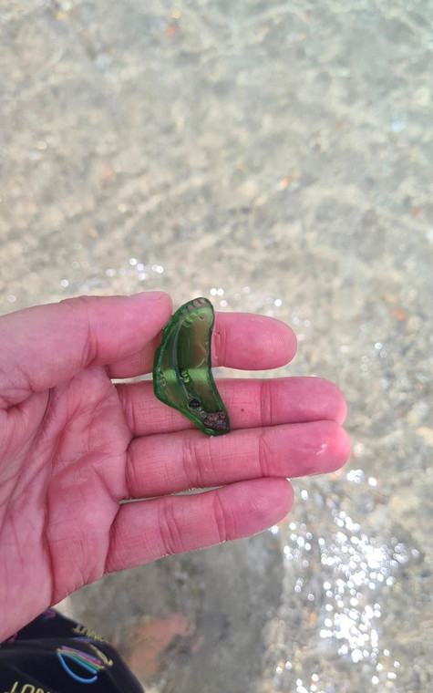 Shards of glass on the hotel's private beach