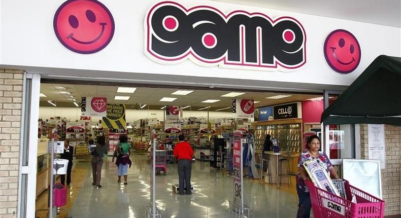 A shopper leaves the Game store in South Gate mall south of Johannesburg September 27, 2010. REUTERS/Siphiwe Sibeko