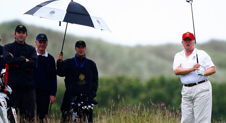 Donald Trump playing golf during the opening of his Trump International Golf Links golf course near Aberdeen in northeast Scotland in 2012.