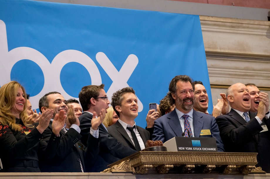 Online data storage provider Box Inc Co-Founder and CEO Aaron Levie (C) rings the opening bell to celebrate his company's IPO at the New York Stock Exchange January 23, 2015. Box Inc's shares rose as much as 77 percent in their debut on Friday as investors shrugged off concerns about the company's ability to turn profitable in a highly competitive market.