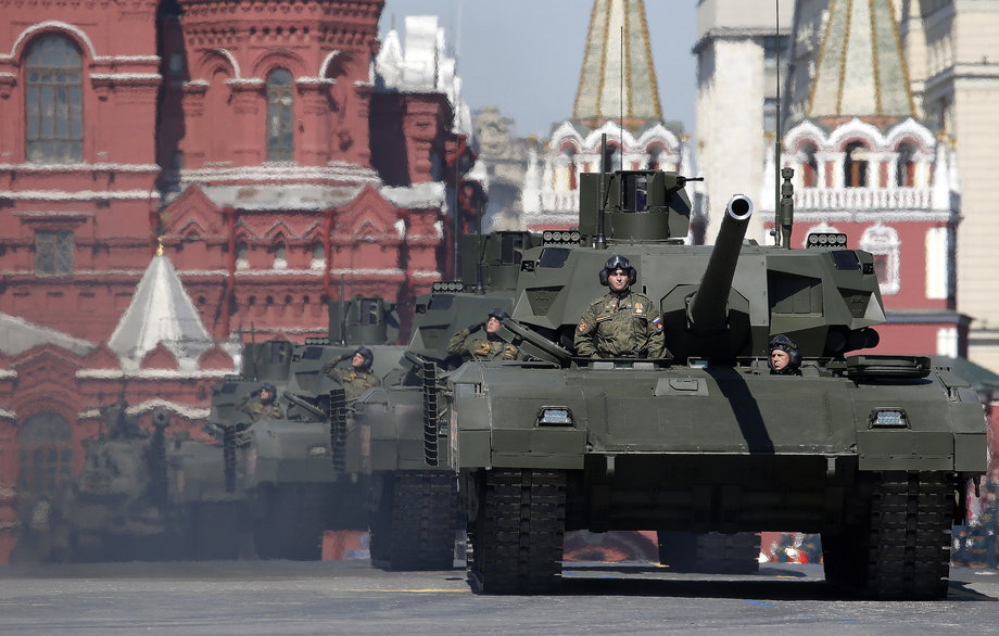 Russian servicemen stand atop T-14 tanks with the Armata Universal Combat Platform during the Victory Day parade, marking the 71st anniversary of the victory over Nazi Germany in World War Two, at Red Square in Moscow, Russia, May 9, 2016.