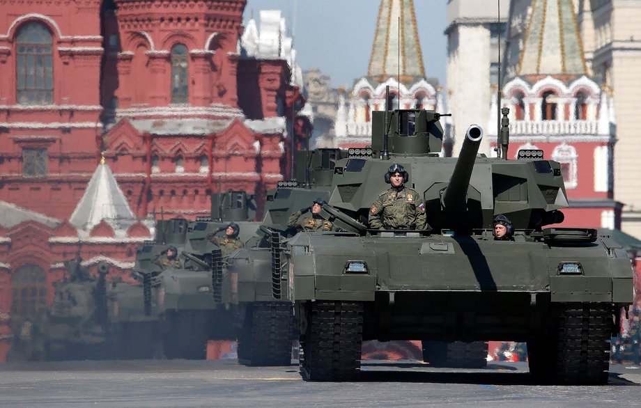 Russian servicemen stand atop T-14 tanks with the Armata Universal Combat Platform during the Victory Day parade, marking the 71st anniversary of the victory over Nazi Germany in World War Two, at Red Square in Moscow, Russia, May 9, 2016.