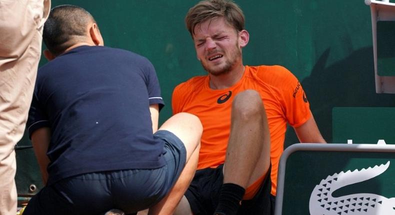 Belgium's David Goffin quit his third round match at the French Open after suffering a freak ankle injury when he got caught up in the court covers