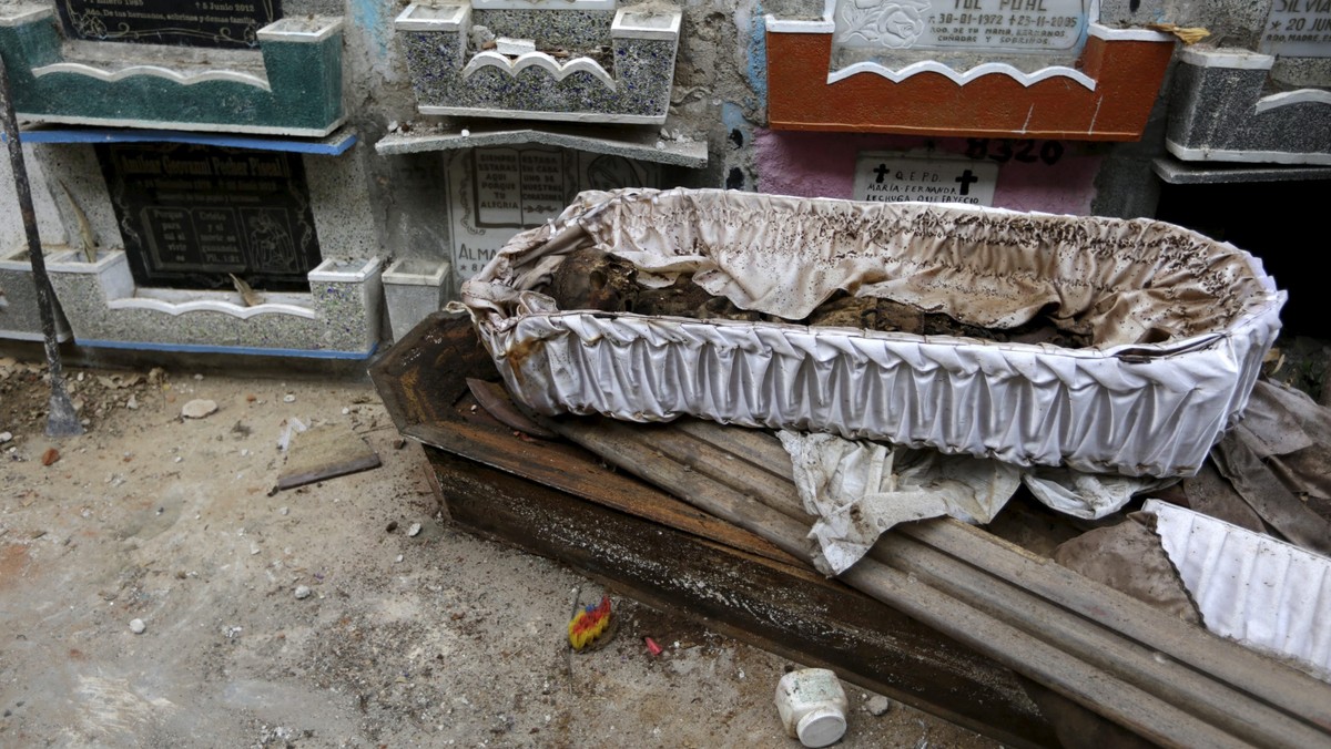 A skeleton is seen in its coffin during exhumation work at the General Cemetery in Guatemala City