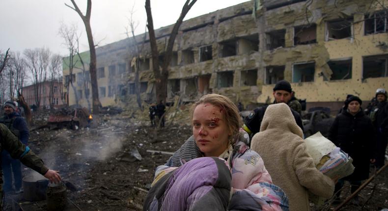 Mariana Vishegirskaya stands outside a maternity hospital that was damaged by shelling in Mariupol, Ukraine, Wednesday, March 9, 2022. Vishegirskaya survived the shelling and later gave birth to a girl in another hospital in Mariupol.