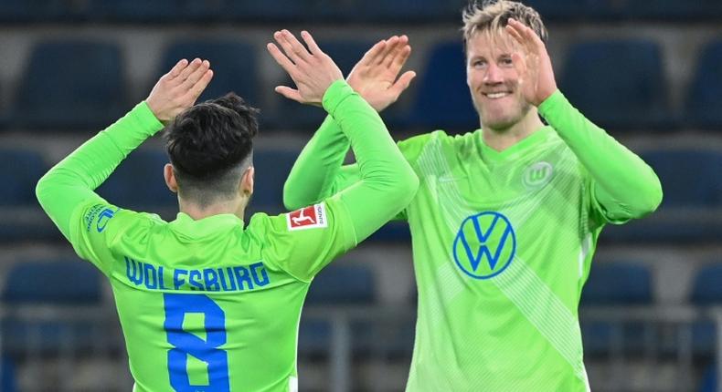 Two strikes: Wolfsburg midfielder Renato Steffen (left) celebrates scoring