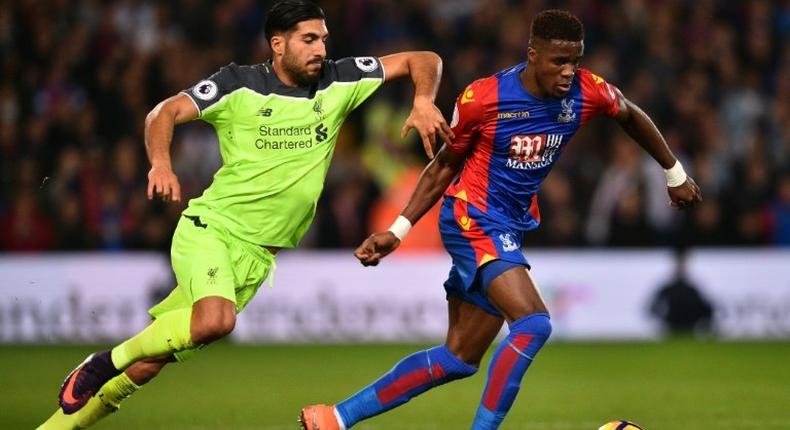 Crystal Palace's striker Wilfried Zaha (R) vies with Liverpool's midfielder Emre Can during the English Premier League football match between Crystal Palace and Liverpool at Selhurst Park in south London on October 29, 2016