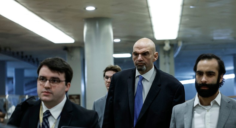 Democratic Sen. John Fetterman of Pennsylvania (C) walks to a classified briefing on Capitol Hill with his senior advisor Bobby Maggio (L) and spokesman Joe Calvello (R) on February 14, 2023 in Washington, DC.Anna Moneymaker/Getty Images