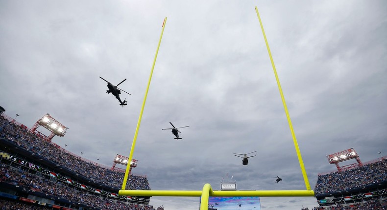 Military helicopters fly over Nissan Stadium before the Tennessee Titans face the New Orleans Saints at Nissan Stadium on November 14, 2021 in Nashville, Tennessee.