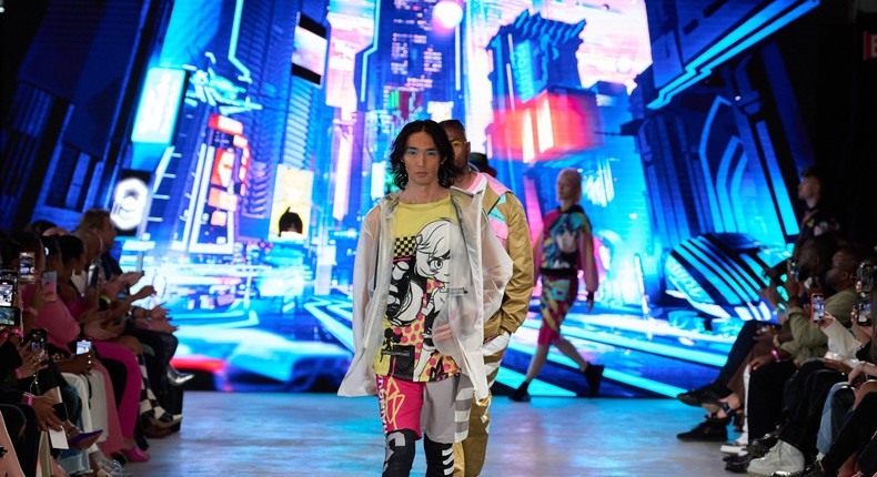 Wearing concept clothes from ChainGuardians, a model walks the runway at a NYFW show.