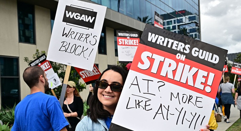 Some Hollywood writers have brought levity to their signs on the WGA's picket lines. But the stakes of this fight — the industry's future — are no laughing matter.FREDERIC J. BROWN/AFP via Getty Images