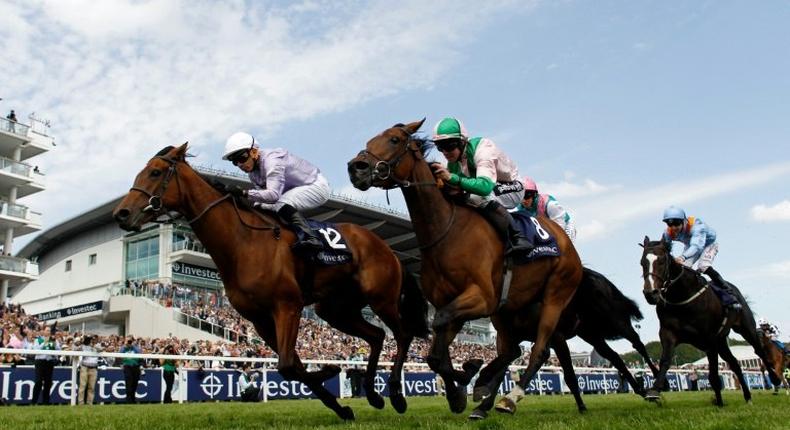 Champion jockey Jim Crowley (pictured (C) on Merry Me in 2015) was brought down along with German-born Freddy Tylicki and two other jockeys in a four-horse pile-up at Kempton Park in October 2016